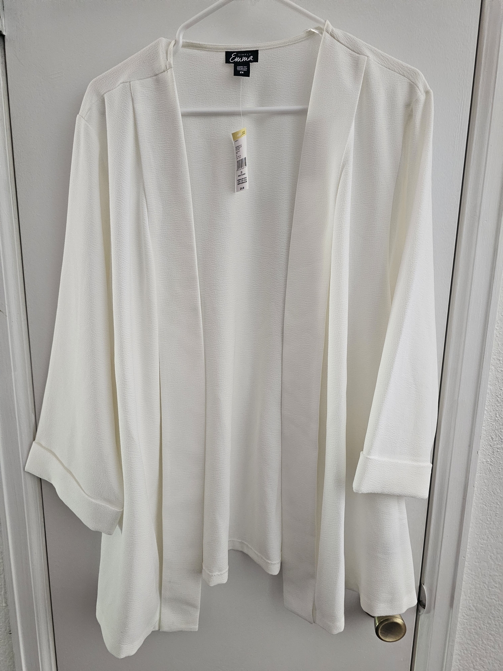 Simply Emma Black Logo Tag on Cream Garment